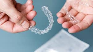 hand holding clear aligners